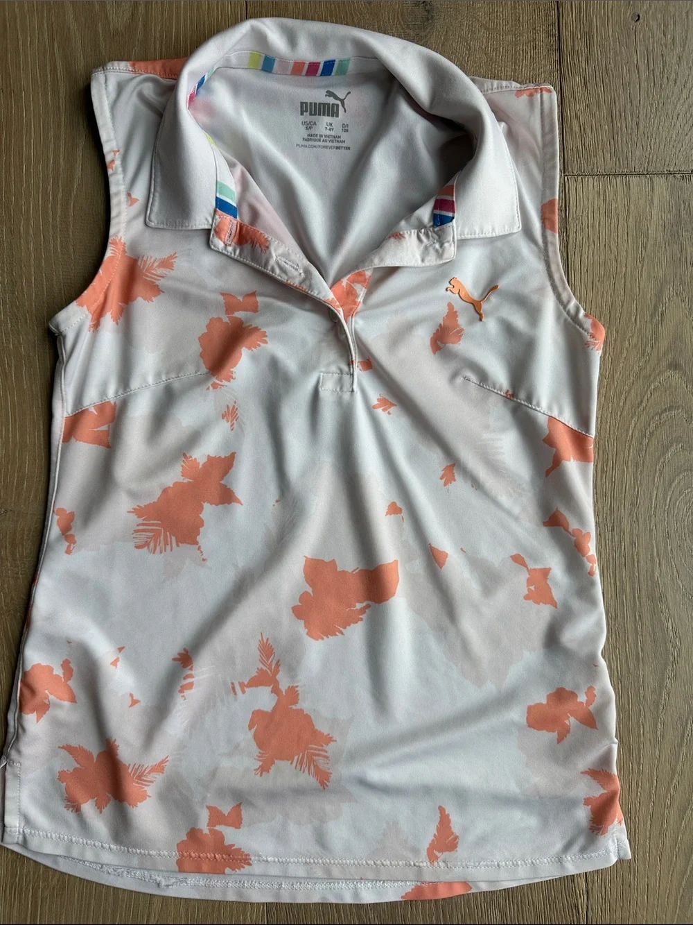 Puma White Sleeveless Polo with Coral Floral Accents